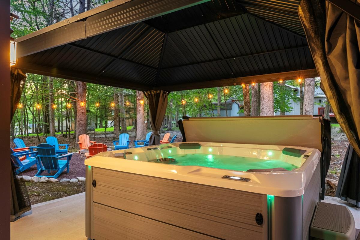 Outdoor Oasis: Relax in the hot tub under twinkling lights surrounded by nature’s beauty!