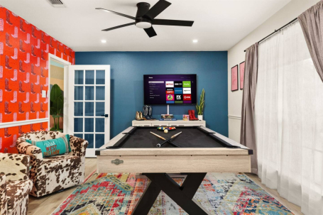 The moment you step in, the bold colors and playful design set the stage for a fun-filled time. The pool table, cozy seating, and entertainment setup make it impossible not to feel the excitement!